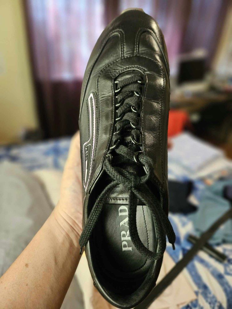 Prada Black Leather Sneakers Size 9 (Category: Sneakers & Footwear) located in Cebu City. Submitted by citygirl829 (Listing ID 1466452830, Image 1). Description: - Brand: Prada (Made in Italy) - Style/Model: 2EG286 Low Top Sneakers - Size: US 9 / UK 8 - Material: Premium black leather upper with durable gum rubber soles - Features: Black laces, subtle Prada logo on the side trim and insole - Condition: Clean upper, solid build, classic luxury run