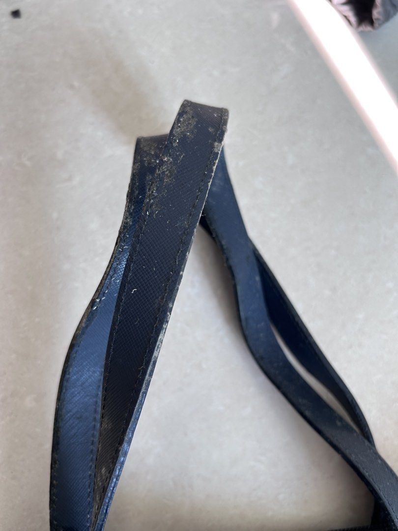 Prada Blue Patterned Nylon Tote Bag with Strap （分類：手袋及銀包）位於 Hong Kong。 由 2019jenjen 提交（商品編號 1466432606，圖片 3）。簡介： Pre-owned Prada Tessuto Stampato Tote Prada tote bag in blue and black patterned fabric. Double top handles plus an extra detachable shoulder strap still wrapped up. (two way wearing) Zip top closure. Signature triangle metal logo on the front. Interior lined with Prada logo fabric, includes a zip pocket and a slip pocket with a metal 