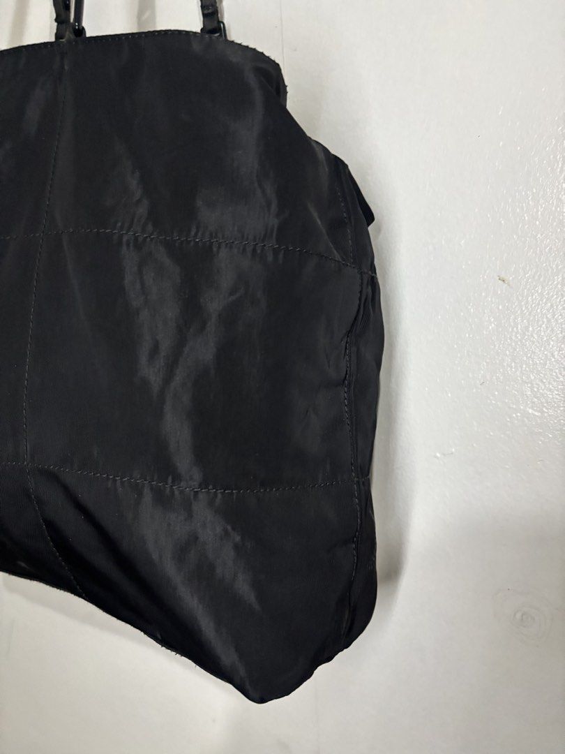 Prada Nylon Tote (Category: Luxury Bags & Wallets) located in Legazpi City. Submitted by thesource052 (Listing ID 1466515819, Image 3). Description: Prada Nylon Tote Bag With Link Handle. Length:11” Inches Width:15.5” inches Excellent condition Guaranteed Authentic White tag number 104 Vintage No major issues.