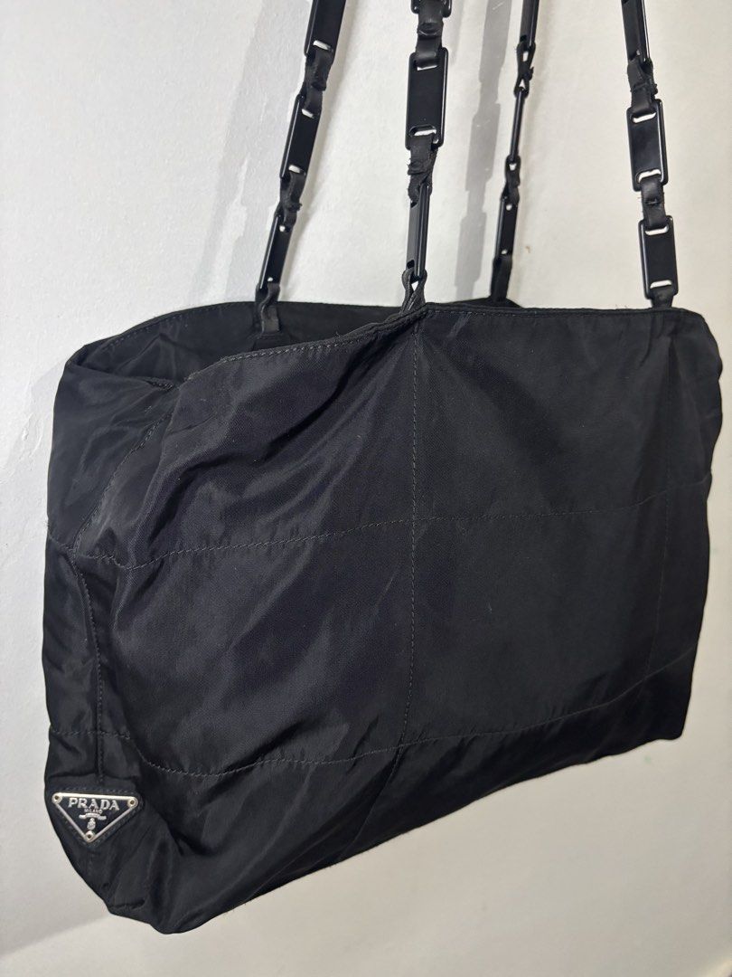 Prada Nylon Tote (Category: Luxury Bags & Wallets) located in Legazpi City. Submitted by thesource052 (Listing ID 1466515819, Image 2). Description: Prada Nylon Tote Bag With Link Handle. Length:11” Inches Width:15.5” inches Excellent condition Guaranteed Authentic White tag number 104 Vintage No major issues.