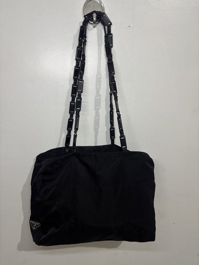 Prada Nylon Tote (Category: Luxury Bags & Wallets) located in Legazpi City. Submitted by thesource052 (Listing ID 1466515819, Image 1). Description: Prada Nylon Tote Bag With Link Handle. Length:11” Inches Width:15.5” inches Excellent condition Guaranteed Authentic White tag number 104 Vintage No major issues.