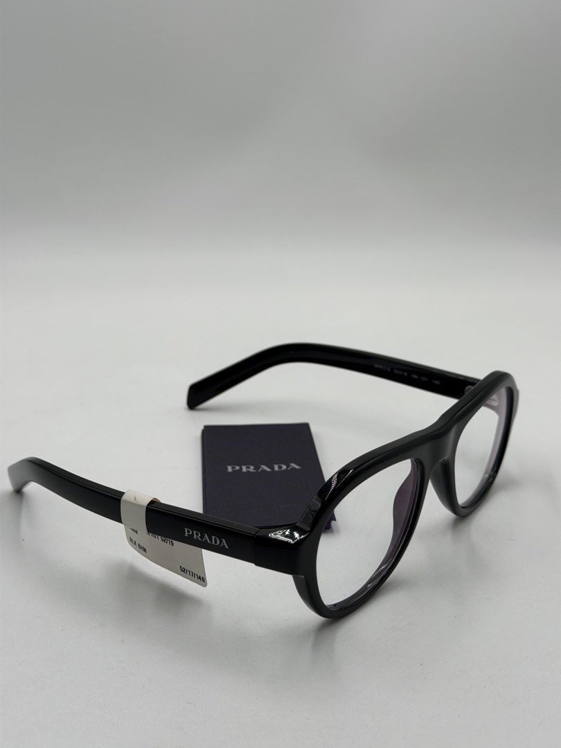 Prada PR C12V Optical Glasses in (Category: Luxury Accessories) located in Lipa City. Submitted by _cmluxephilippines (Listing ID 1466405534, Image 1). Description: Prada PR C12V Optical Glasses in polished black acetate, featuring a bold, pilot-inspired pillow shape with the engraved Prada logo on the temples.