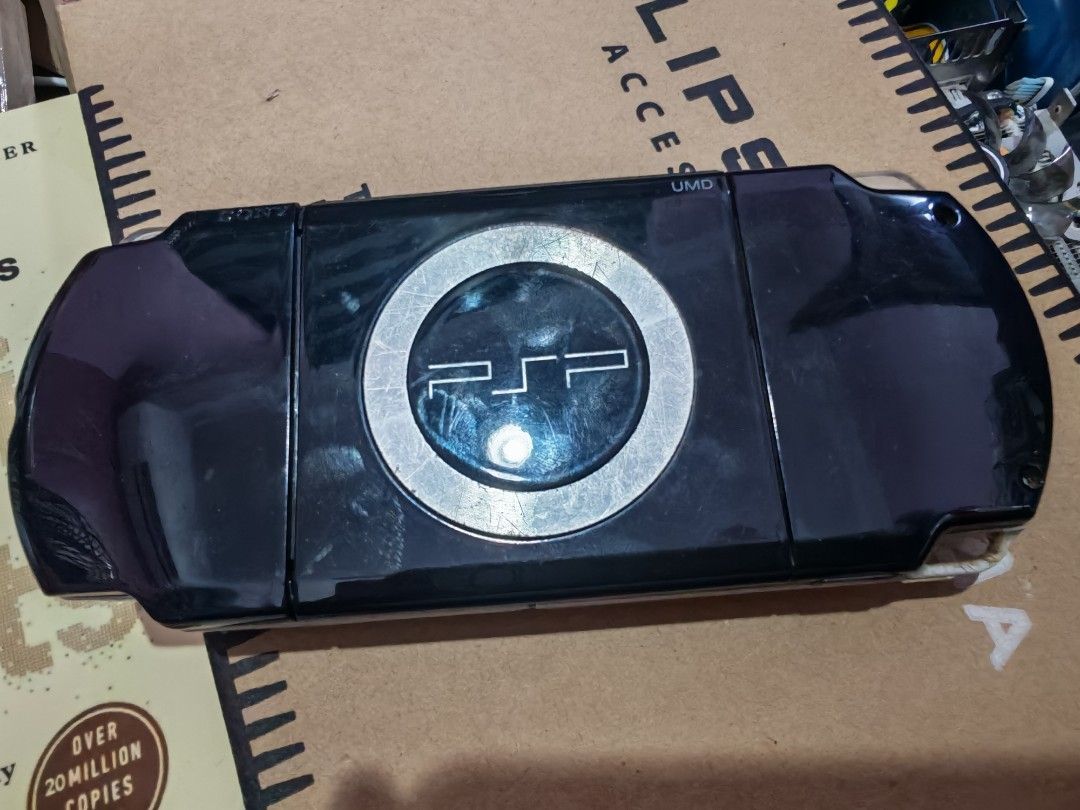 PSP 2000 (Category: PlayStation) located in Kangar. Submitted by hazard_puppet (Listing ID 1466407921, Image 2). Description: psp 2000 heavily used condition, lots of scratch, battery cover lock mechanism already broken. can still use, but screen has 1 dot. selling as is, no warranty whatsoever. console and battery only. semenanjung postate add rm7. .