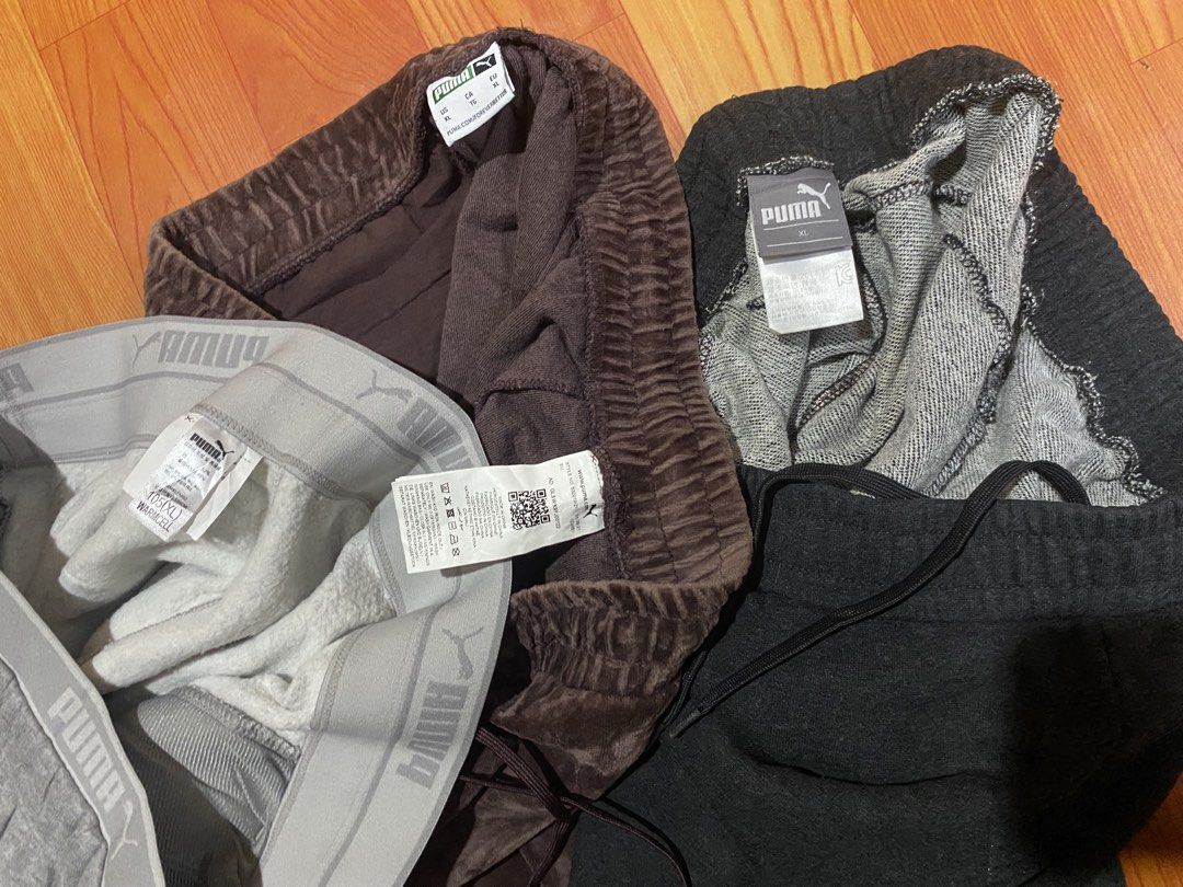 Puma Sweatpants Bundle Set Size XL Grey Brown Black (Category: Joggers) located in Cebu City. Submitted by monflor (Listing ID 1466483429, Image 3). Description: - Brand: Puma - Size: XL - Colors/Styles: Light grey (wide elastic waistband), brown velvet style (gold logo embroidery), and dark grey (white logo) - Features: Adjustable drawstrings and soft interior lining on all pairs - Ideal for: Lounging, casual wear, or workouts - Condition: excel