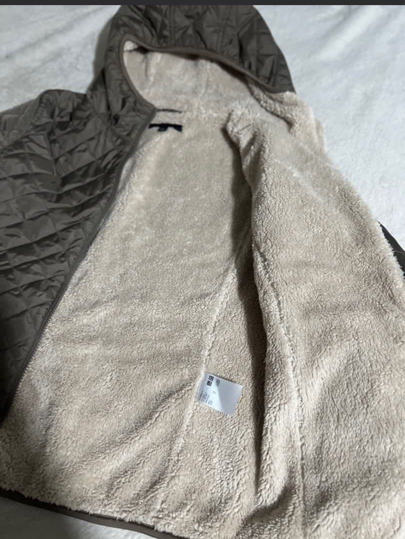 Quilted Sherpa Lined Hooded Jacket Size M (Category: Coats, Jackets and Outerwear) located in Pasig City. Submitted by prelovedbyaim_ (Listing ID 1466337096, Image 2). Description: - Color: Brown - Material: Quilted exterior with thick sherpa fleece lining - Features: Attached hood and front zipper closure - Size: Medium (tag sewn near collar) - Origin: Made in China - Condition/Use: Warm winter layer, ideal for colder days.