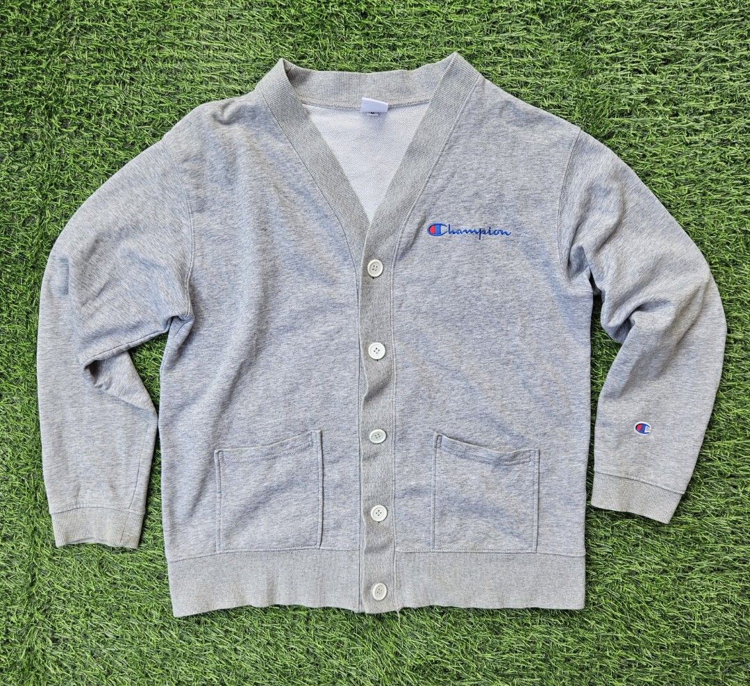 Rare Champion Cardigan (Category: Coats, Jackets and Outerwear) located in Las Pinas. Submitted by rcp123 (Listing ID 1466465598, Image 1). Description: - Brand: Champion - Vintage - Style: Grey button-up cardigan with V-neck - Size: Medium (M) - Unisex - Material: 100% cotton - Details: Embroidered script logo on chest, classic C logo patch on left sleeve, two front pockets - Condition: Excellent, ready to wear - Perfect for layering and casual 