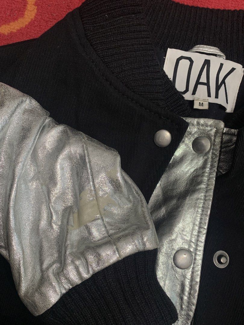 Rare OAK Genuine Leather Silver Toned Varsity Jacket (Category: Coats, Jackets and Outerwear) located in Manila. Submitted by archivo (Listing ID 1466519639, Image 2). Description: 📌 Details: - Size: Medium - Color rate: 9/10 - Condition: Mint - Issue/s: Small paint chip.