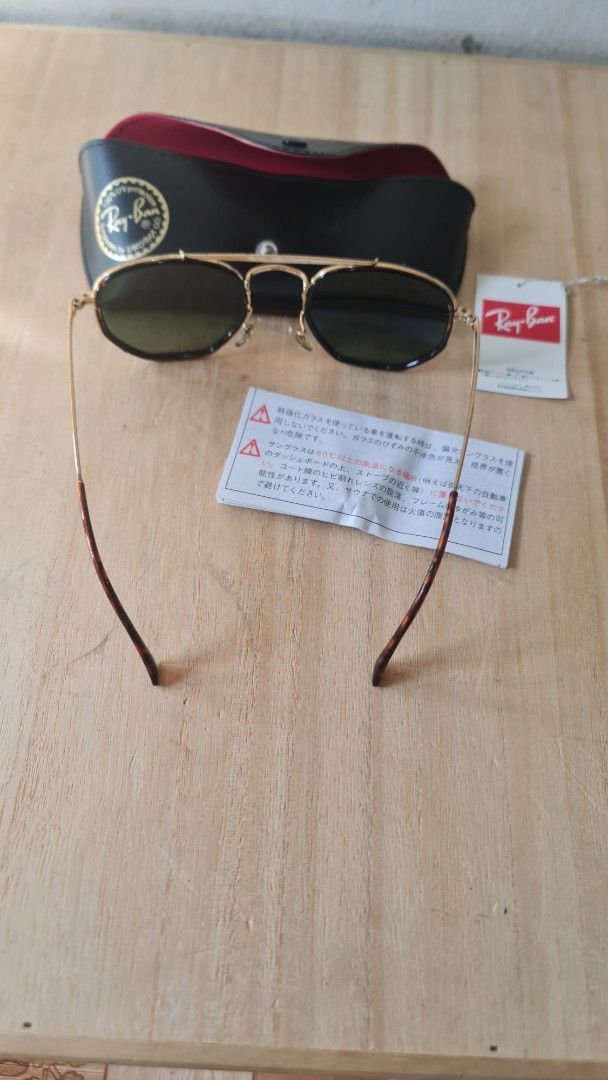 Ray-Ban Aviator Sunglasses with Case (Category: Sunglasses & Eyewear) located in Caloocan City. Submitted by royaldragon_d59aba (Listing ID 1466481855, Image 3). Description: - Brand: Ray-Ban - Style: Classic Pilot with gold double bridge - Frame: Gold with tortoise shell temples and ear tips - Lenses: Green (clean, no scratches) - Inclusions: Original black leather case with red interior, product tags, and care pamphlet - Condition: Excellent pr