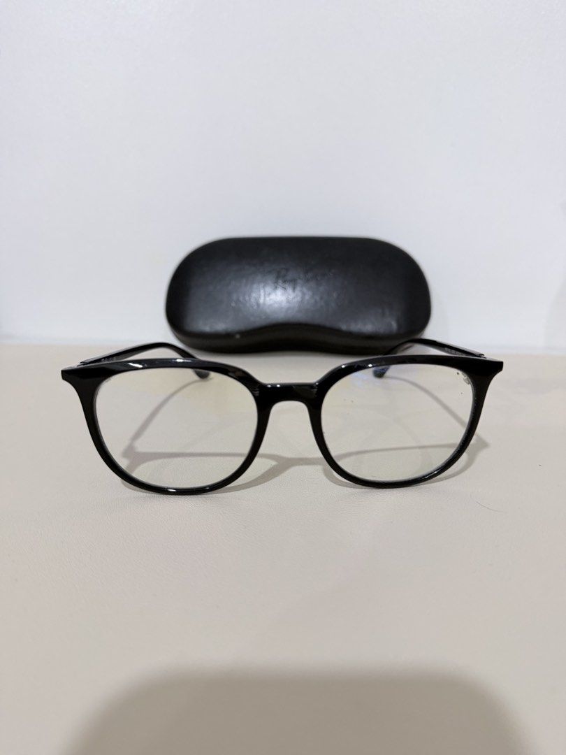 Ray-Ban RB 7190 Reading Eyeglasses (Category: Sunglasses & Eyewear) located in Manila. Submitted by prelovedbymycam (Listing ID 1466350697, Image 1). Description: Ray-Ban optical frames in black acetate. Model RB 7190, size 53-19-145. Glossy finish on the front frames with silver temples and black tips. Original Ray-Ban hard leather case included. Standard clear demo lenses installed, ready for your prescription lenses at the optician..