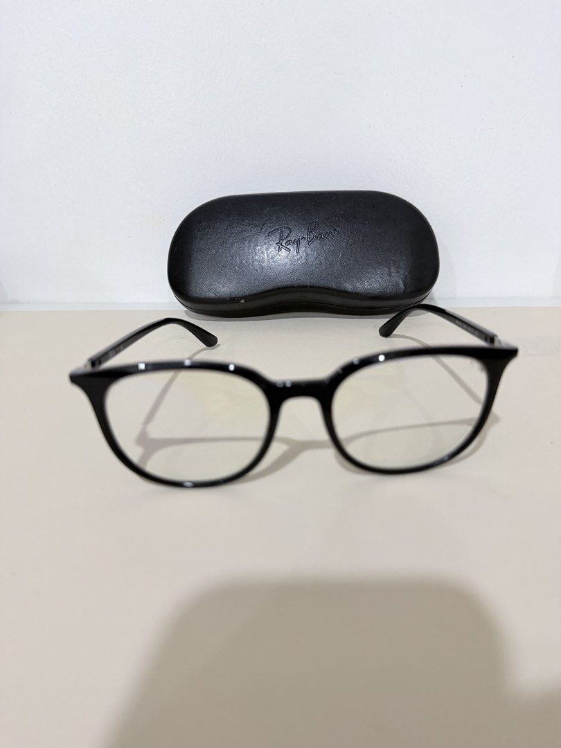 Ray-Ban RB 7190 Reading Eyeglasses (Category: Sunglasses & Eyewear) located in Manila. Submitted by prelovedbymycam (Listing ID 1466350697, Image 2). Description: Ray-Ban optical frames in black acetate. Model RB 7190, size 53-19-145. Glossy finish on the front frames with silver temples and black tips. Original Ray-Ban hard leather case included. Standard clear demo lenses installed, ready for your prescription lenses at the optician..