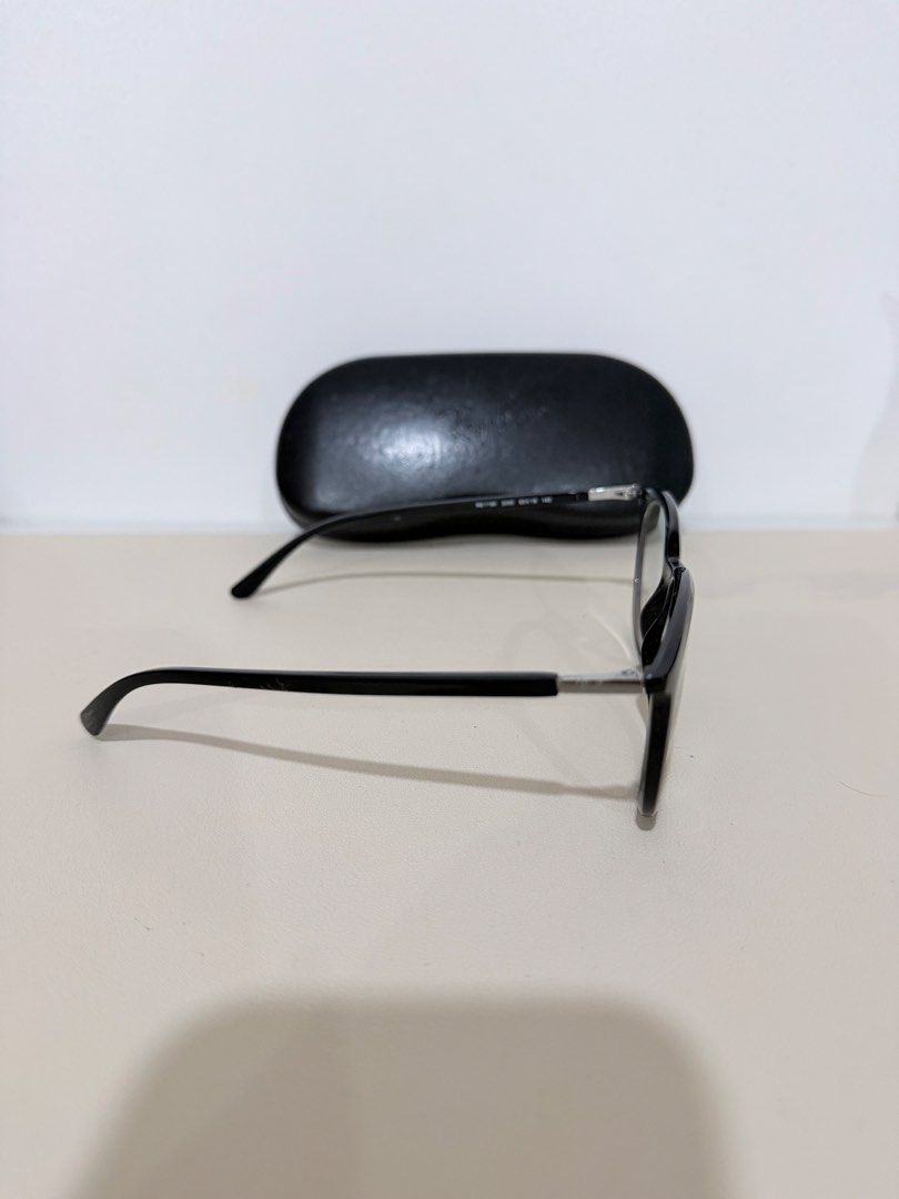 Ray-Ban RB 7190 Reading Eyeglasses (Category: Sunglasses & Eyewear) located in Manila. Submitted by prelovedbymycam (Listing ID 1466350697, Image 3). Description: Ray-Ban optical frames in black acetate. Model RB 7190, size 53-19-145. Glossy finish on the front frames with silver temples and black tips. Original Ray-Ban hard leather case included. Standard clear demo lenses installed, ready for your prescription lenses at the optician..