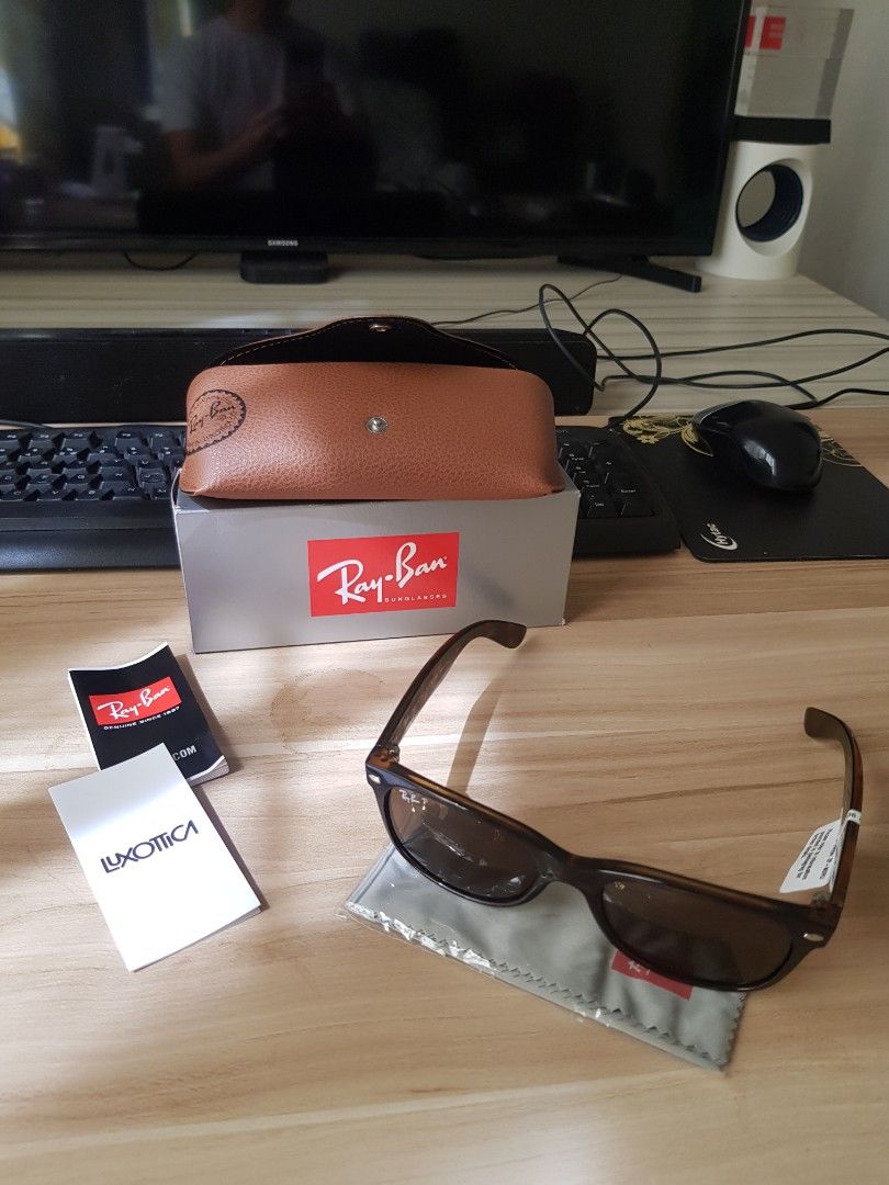 Ray-Ban Sunglasses with Case and Accessories (Category: Sunglasses & Eyewear) located in Manila. Submitted by anthonylee23810 (Listing ID 1466449016, Image 1). Description: - Authentic Ray-Ban sunglasses featuring stylish tortoise-shell frames and dark lenses - Complete full-set inclusion: original grey storage box and brown leather-look snap-button case - Includes brand-new grey cleaning cloth still sealed in plastic - Comes with official Luxott