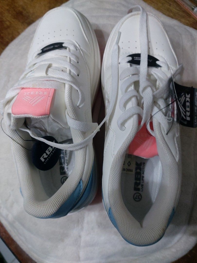 RBX white rubber shoes (Category: Activewear) located in Quezon City. Submitted by bettymeir07 (Listing ID 1466455933, Image 2). Description: RBX white rubber shoes with pink and light blue trimming size.