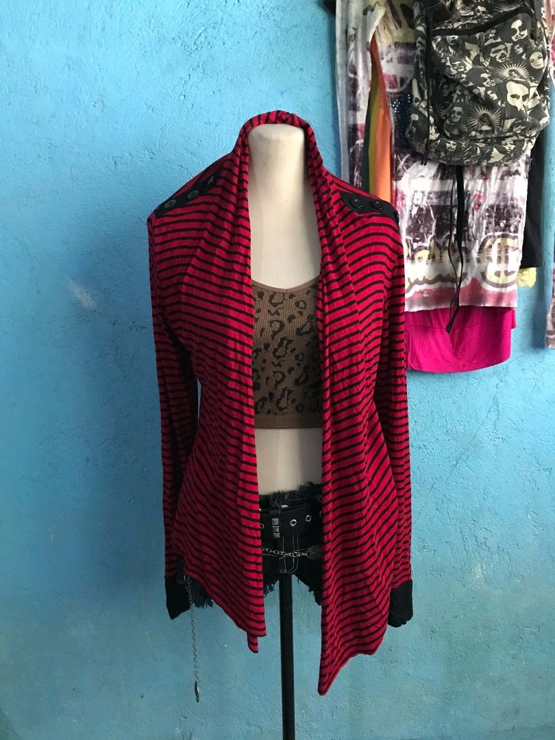 Red and Black Striped Cardigan (Category: Coats, Jackets and Outerwear) located in Alaminos. Submitted by elysian_thrifts (Listing ID 1466506775, Image 1). Description: - Color/Pattern: Red and black stripes - Material: Lightweight and easy to layer - Design: Open front with a stylish waterfall hemline - Details: Contrasting black shoulder patches and cuffs - Style: Long sleeves, perfect for adding a pop of color to casual looks.