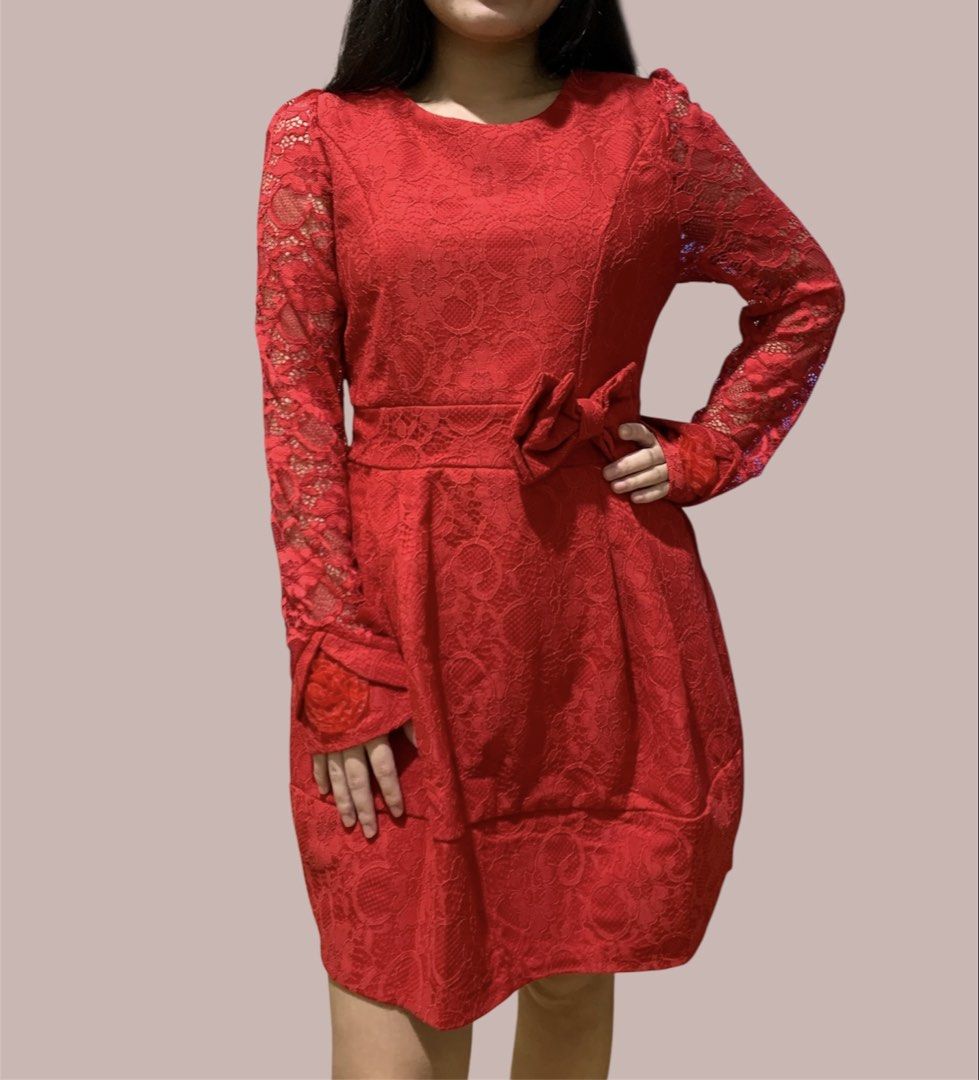 Red Lace Dress Long Sleeve (Category: Dresses) located in Manila. Submitted by meimei6767 (Listing ID 1466434427, Image 1). Description: - Fit to Small to medium - Color & Style: Vibrant red lace, knee-length fit and flare cut - Sleeves: Long sheer lace sleeves with flower accent at the cuff - Details: Matching fabric bow at the side waist, round neckline, back zipper closure - Condition: Worn once, very clean and well-maintained.