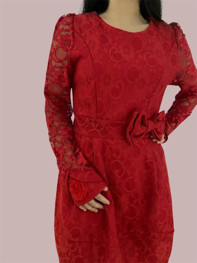 Red Lace Dress Long Sleeve (Category: Dresses) located in Manila. Submitted by meimei6767 (Listing ID 1466434427, Image 2). Description: - Fit to Small to medium - Color & Style: Vibrant red lace, knee-length fit and flare cut - Sleeves: Long sheer lace sleeves with flower accent at the cuff - Details: Matching fabric bow at the side waist, round neckline, back zipper closure - Condition: Worn once, very clean and well-maintained.