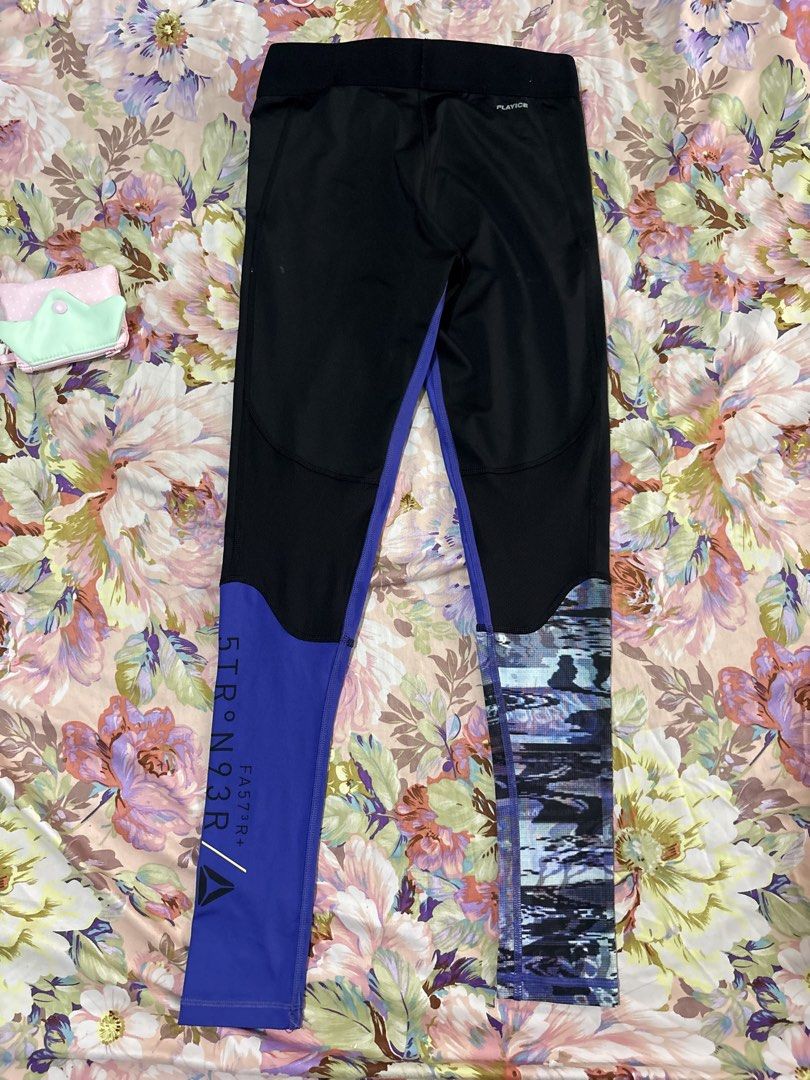 Reebok Black Purple Pattern Activewear Leggings Size M (Category: Activewear) located in Paranaque City. Submitted by delikaite (Listing ID 1466417261, Image 2). Description: - Brand: Reebok - Size: Medium (M) - Colors/Design: Black, purple, and a stylish patterned design on one leg - Material: High-stretch fabric for maximum flexibility - Features: Reebok logo near the hip and lower leg - Best For: Gym sessions, running, and everyday activewear 