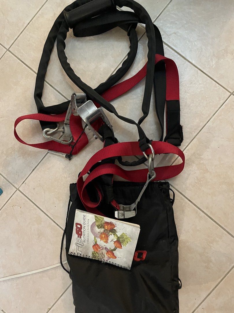 Rip:60 Suspension Trainer Workout System with Guide (Category: Cardio & Fitness Machines) located in Cebu City. Submitted by modelrunway (Listing ID 1466375939, Image 1). Description: - Item: Rip:60 Suspension Training Kit - Color: Black and Red - Condition: Complete set with straps, metal hardware, sturdy handles, and storage pouch - Bonus: Includes original 8-week nutrition guide booklet - Features: Ideal for home or outdoor bodyweight workouts