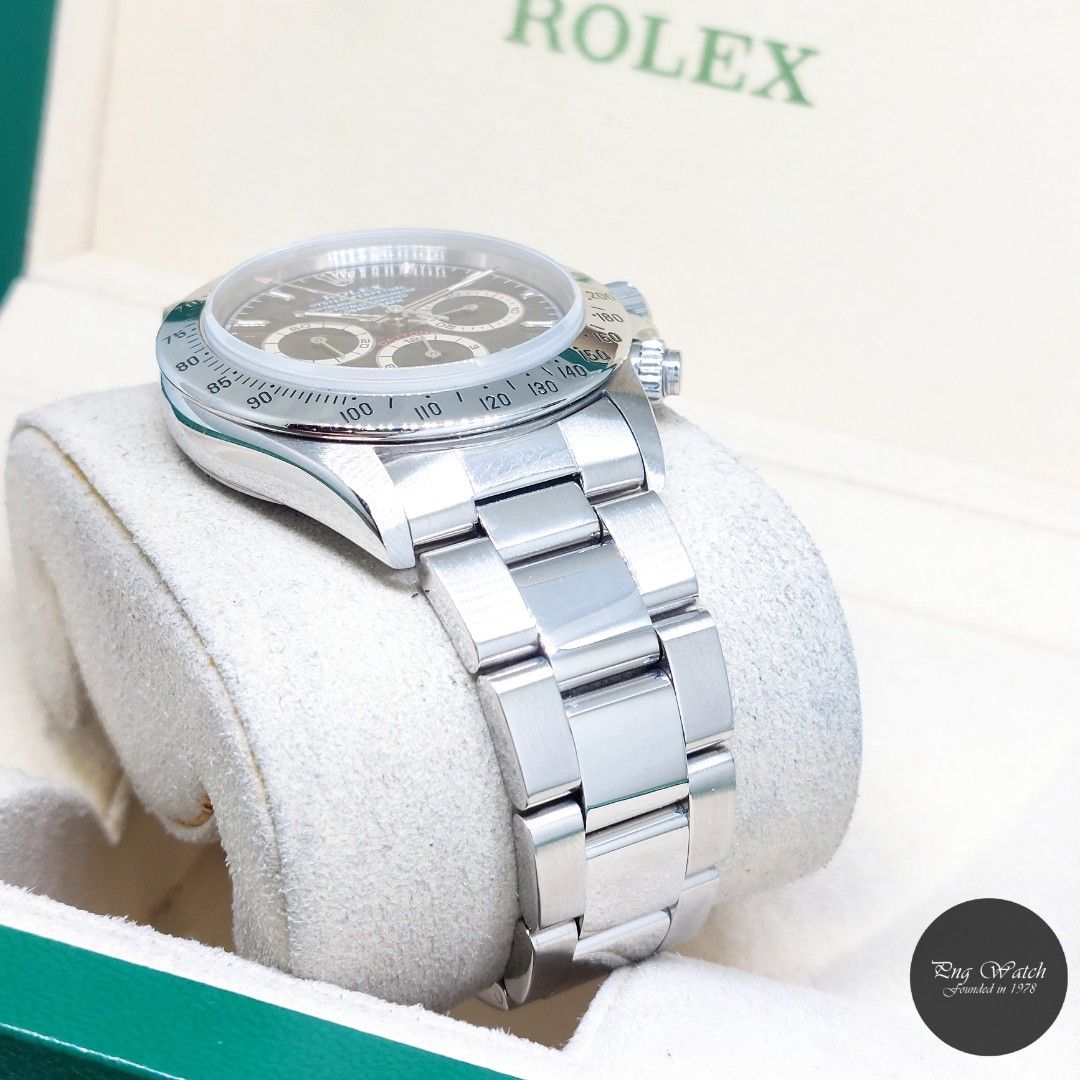 Rolex 40mm Stainless Steel Black Sticks Dial "Zenith Mvt" Daytona REF: 16520 (U Series) (Category: Watches) located in Singapore. Submitted by pngwatchdealer (Listing ID 1466480371, Image 3). Description: [SPECIFICATIONS] **Watch comes with a generic pouch only** Brand: Rolex Model: Oyster Perpetual Daytona (REF: 16520)(U) Movement: Automatic (Self-Winding) Functions and Features: Chronograph, Hours, Minutes and Seconds (CASE) Case Material: Stai