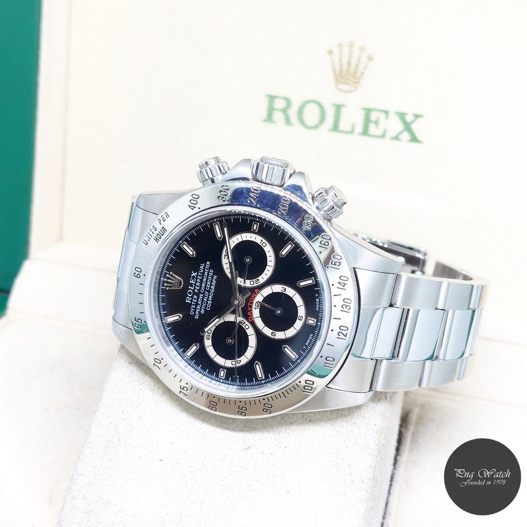 Rolex 40mm Stainless Steel Black Sticks Dial "Zenith Mvt" Daytona REF: 16520 (U Series) (Category: Watches) located in Singapore. Submitted by pngwatchdealer (Listing ID 1466480371, Image 2). Description: [SPECIFICATIONS] **Watch comes with a generic pouch only** Brand: Rolex Model: Oyster Perpetual Daytona (REF: 16520)(U) Movement: Automatic (Self-Winding) Functions and Features: Chronograph, Hours, Minutes and Seconds (CASE) Case Material: Stai