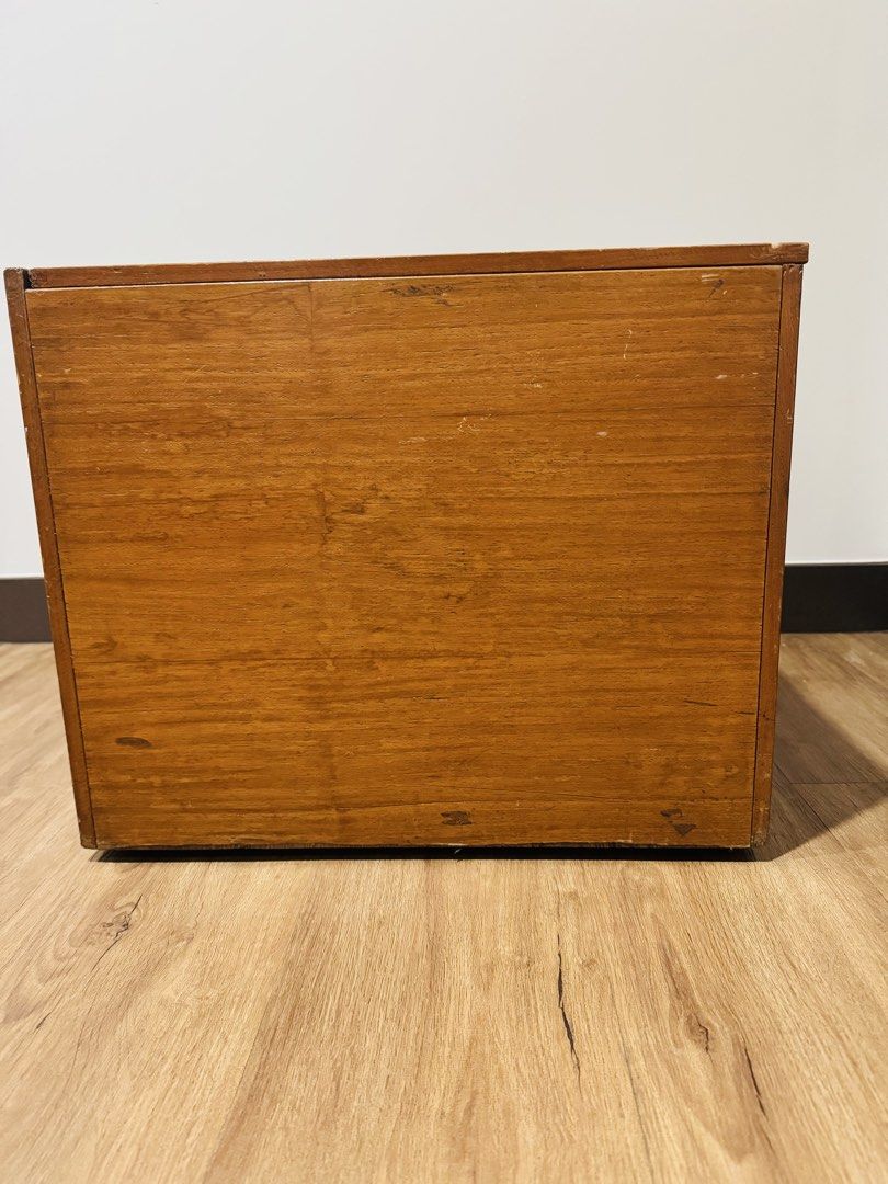 Rolling Wooden Storage Box / Side Table with Hinged Lid & Casters (Category: Storage Boxes & Baskets) located in Makati City. Submitted by avic_c (Listing ID 1466393409, Image 2). Description: Compact wooden storage box with hinged lift-up top and 4 caster wheels, making it easy to move around. Useful as hidden storage beside a desk, bed or sofa, or as a small movable side table. The simple wooden design works well for storing books, office suppl