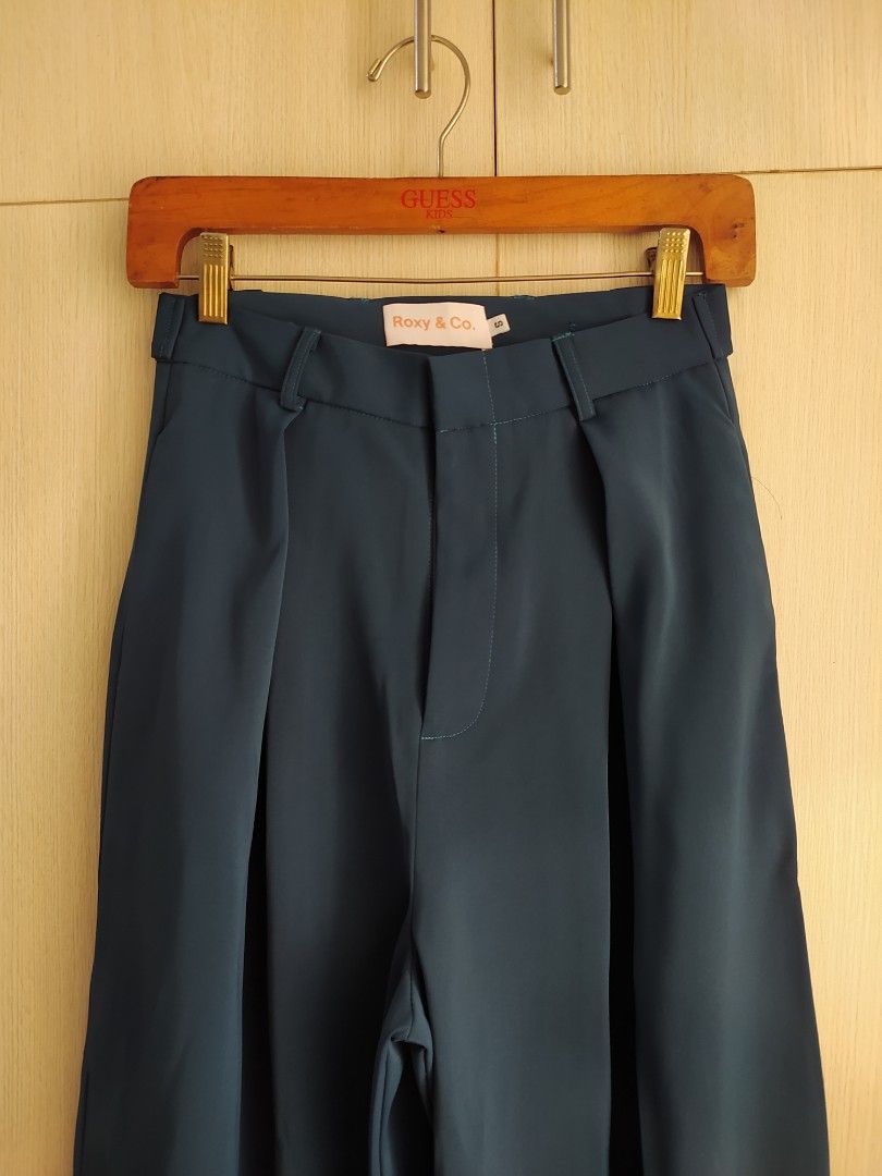 Roxy & Co Emma Adjustable Trousers - Navy Teal (Category: Other Bottoms) located in Bacoor. Submitted by lieze (Listing ID 1466444271, Image 1). Description: wide leg, high waist very comfy suotin from roxy & co on tiktok orig price 2,640 in navy teal color fit to 25-26 waistline.