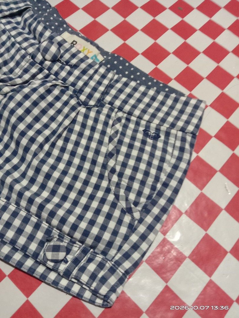 Roxy Blue White Gingham Checked Shorts (Category: Shorts) located in Danao, Cebu. Submitted by rennan.546 (Listing ID 1466407156, Image 2). Description: - Brand: Roxy dimention 32x9.5 color rate 9.9/10 issue none loc danao city Cebu city - Design: Classic blue and white gingham check with cuffed hems - Details: Contrast blue and white polka dot inner waistband lining - Accents: Small Roxy heart embroidery near the right pocket - Features: Functio