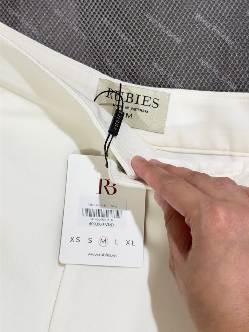 Rubies Studio Orla Shorts White Size M (Category: Shorts) located in Manila. Submitted by ktyyycloset (Listing ID 1466492764, Image 3). Description: - Brand: Rubies Studio - Style: Orla tailored shorts - Color: White - Size: Medium - Condition: Brand new with tags (Original retail: 490,000 VND) - Features: Side pockets, single back welt pocket detail - Origin: Made in Vietnam -Runs small.