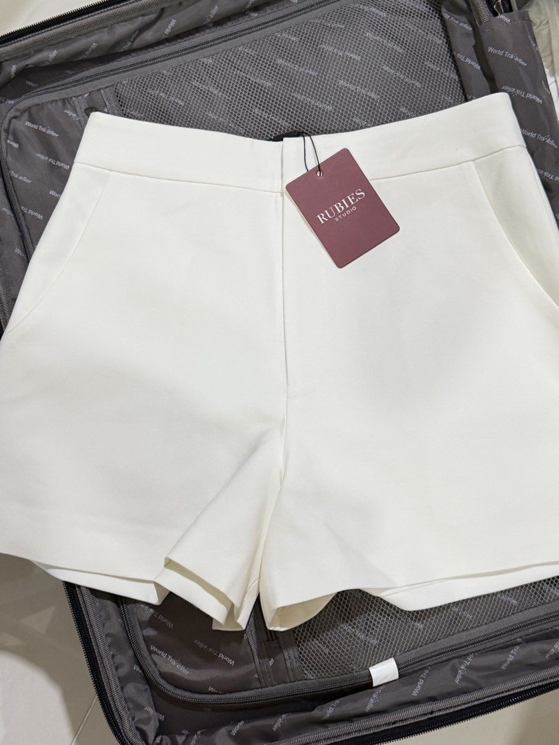 Rubies Studio Orla Shorts White Size M (Category: Shorts) located in Manila. Submitted by ktyyycloset (Listing ID 1466492764, Image 2). Description: - Brand: Rubies Studio - Style: Orla tailored shorts - Color: White - Size: Medium - Condition: Brand new with tags (Original retail: 490,000 VND) - Features: Side pockets, single back welt pocket detail - Origin: Made in Vietnam -Runs small.