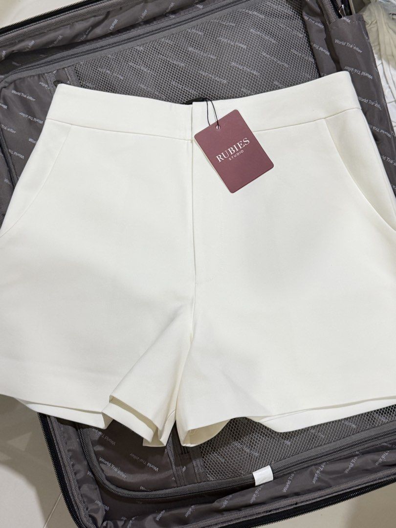 Rubies Studio Orla Shorts White Size M (Category: Shorts) located in Manila. Submitted by ktyyycloset (Listing ID 1466492764, Image 1). Description: - Brand: Rubies Studio - Style: Orla tailored shorts - Color: White - Size: Medium - Condition: Brand new with tags (Original retail: 490,000 VND) - Features: Side pockets, single back welt pocket detail - Origin: Made in Vietnam -Runs small.