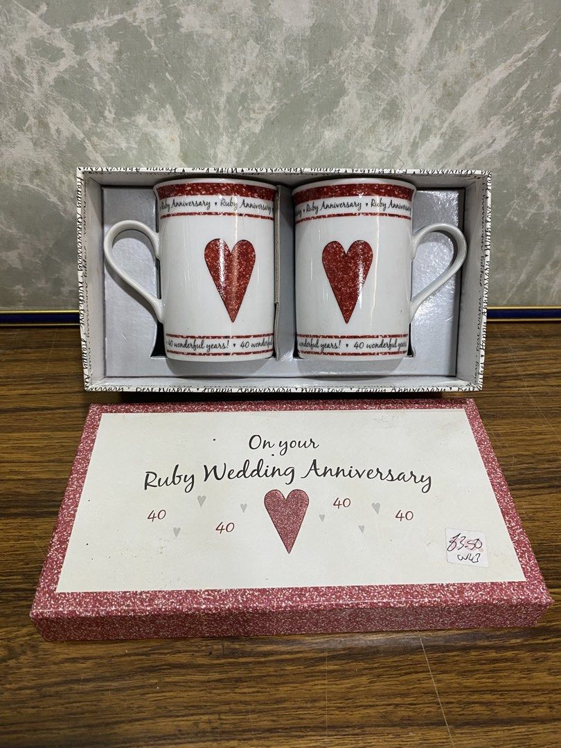 Ruby Wedding 40th Anniversary Porcelain Mugs Set (Category: Coffee & Tea Tableware) located in Calamba. Submitted by chebvintagedepot (Listing ID 1466418135, Image 3). Description: [B20-04] This pair of Juliana Fine Porcelain mugs commemorates a 40th Ruby Wedding Anniversary. These classic white porcelain mugs are printed with “Ruby Anniversary” and “40 wonderful years!” and come complete with the original gift box. A suitable keepsake or gift fo