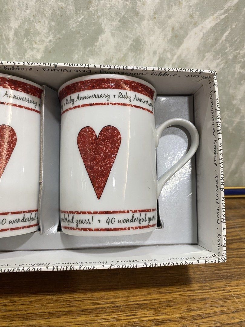 Ruby Wedding 40th Anniversary Porcelain Mugs Set (Category: Coffee & Tea Tableware) located in Calamba. Submitted by chebvintagedepot (Listing ID 1466418135, Image 2). Description: [B20-04] This pair of Juliana Fine Porcelain mugs commemorates a 40th Ruby Wedding Anniversary. These classic white porcelain mugs are printed with “Ruby Anniversary” and “40 wonderful years!” and come complete with the original gift box. A suitable keepsake or gift fo