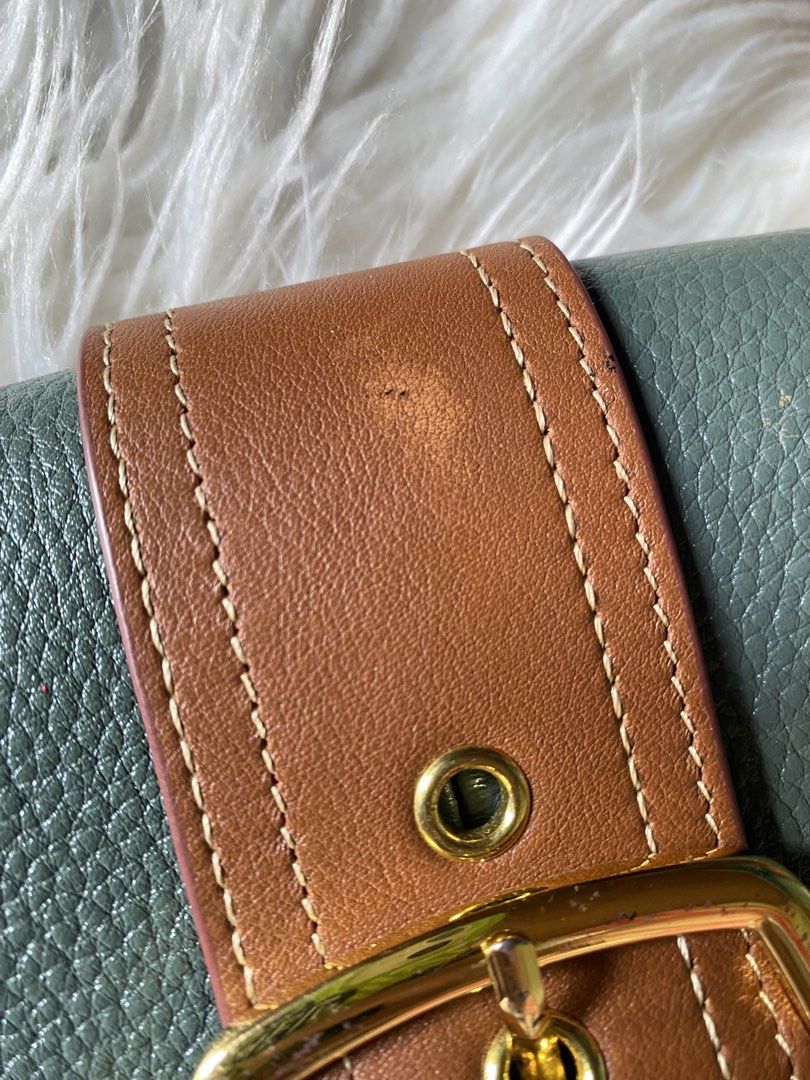 Sage Green and Brown Leather Shoulder Bag (Category: Shoulder Bags) located in Manila. Submitted by kimberlyma95836 (Listing ID 1466413097, Image 2). Description: - Color/Material: Sage green pebbled leather with brown leather accents - Hardware: Gold-toned - Closure: Front flap with decorative buckle and magnetic snap - Handle: Short detachable handle - Interior: Fabric-lined with a zippered pocket and slip pockets - Condition: Great everyday ac