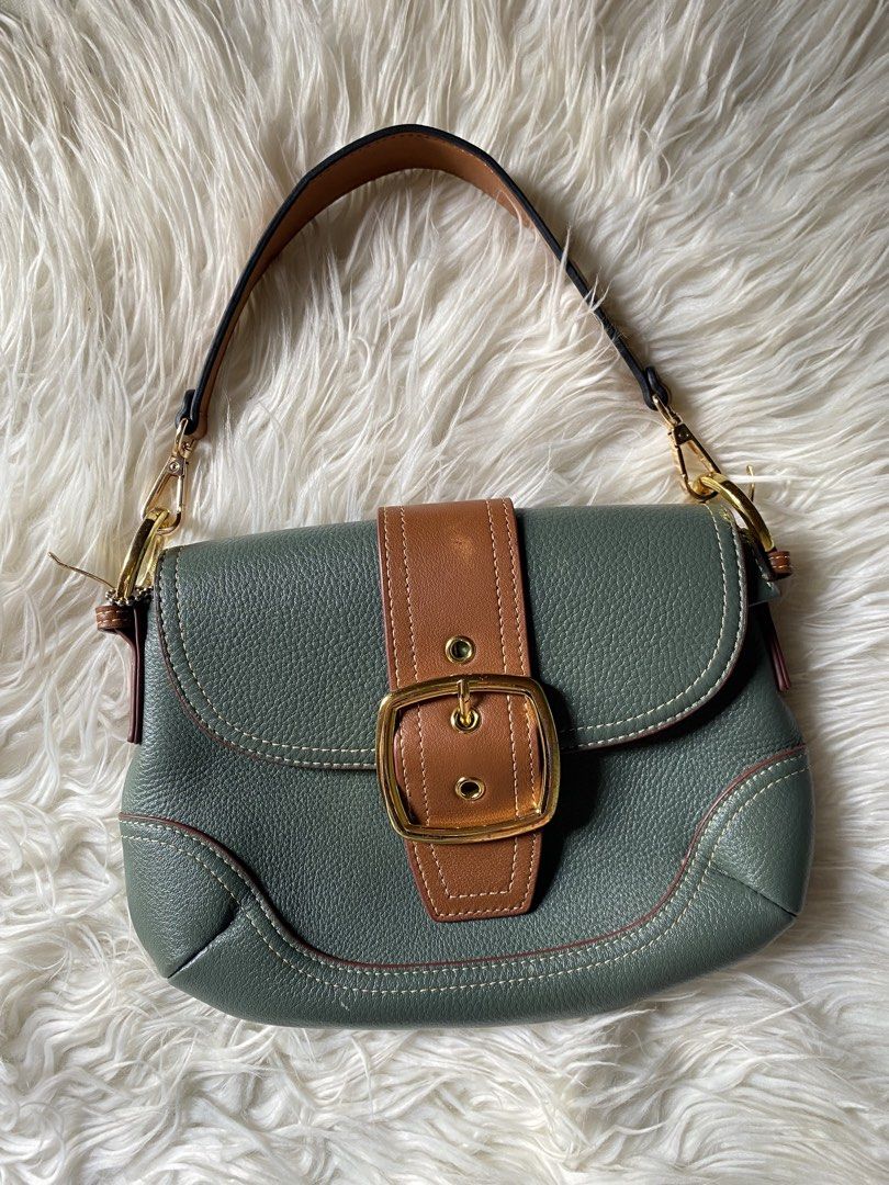Sage Green and Brown Leather Shoulder Bag (Category: Shoulder Bags) located in Manila. Submitted by kimberlyma95836 (Listing ID 1466413097, Image 1). Description: - Color/Material: Sage green pebbled leather with brown leather accents - Hardware: Gold-toned - Closure: Front flap with decorative buckle and magnetic snap - Handle: Short detachable handle - Interior: Fabric-lined with a zippered pocket and slip pockets - Condition: Great everyday ac