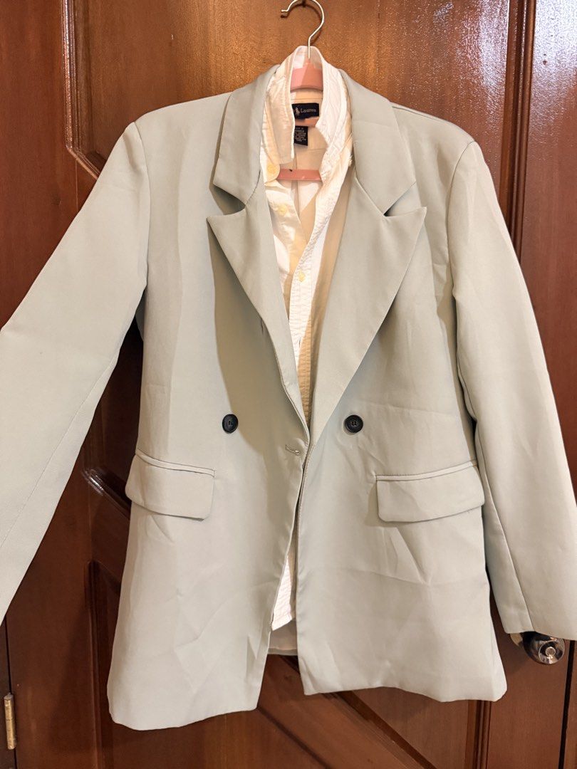 Sage Green Double Breasted Blazer Jacket (Category: Coats, Jackets and Outerwear) located in Mandaluyong City. Submitted by riz_040521 (Listing ID 1466470916, Image 1). Description: - Color: Sage Green - Style: Double-breasted with dark buttons - Features: Notched lapel collar, front flap pockets, long sleeves with cuff button details - Back: Clean design with center seam - Versatile outerwear great for the office or smart casual outfits.