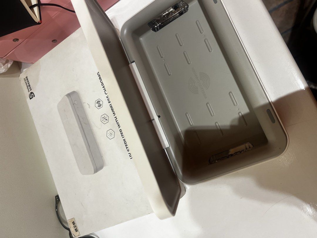 Samsung UV Sterilizer with Wireless Charging (Category: Batteries & Power Banks) located in Mandaluyong City. Submitted by flowgie (Listing ID 1466401775, Image 1). Description: samsung UV STERILIZER WITH WIRELESS CHARGING , working unit , inclusions box lang and manual . lalamove pickup bagumbayan qc - Authentic Samsung UV sterilizer box in clean white - Safely sanitizes small daily essentials like smartphones, keys, and cards - Built-in wireles