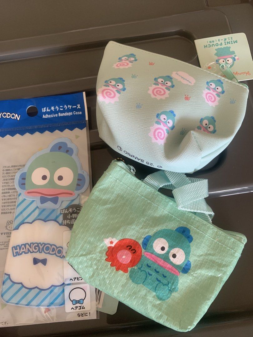 Sanrio Hangyodon （分類：動漫角色周邊）位於 Hong Kong。 由 mqemw 提交（商品編號 1466422535，圖片 1）。簡介： Sanrio人氣角色Hangyodon興魚人周邊，有散紙包、手提袋同埋膠套。全部都係綠色系，上面有得意嘅興魚人公仔同章魚朋友。散紙包有埋吊牌，送禮自用都啱。。