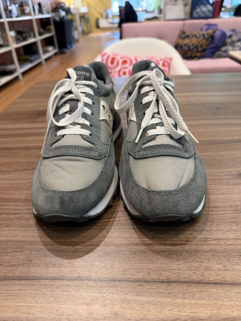 Saucony Jazz Grey Sneakers (Category: Sneakers) located in Taguig. Submitted by mikecons (Listing ID 1466372306, Image 2). Description: - Brand/Model: Saucony Jazz Retro Running Shoes - Colorway: Classic Grey and White - Materials: Premium suede and nylon upper construction - Details: White laces and iconic side branding - Comfort: Cushioned midsole for all-day support - Sole: Durable and textured rubber outsole - Condition: Looks newish with a b