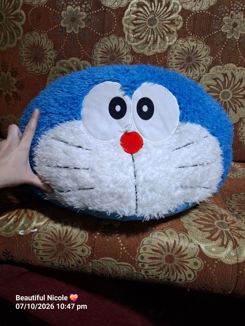 Sega BIG Doraemon Plush Cushion (Category: Plushies & Soft Toys) located in Quezon City. Submitted by NGClove (Listing ID 1466500455, Image 1). Description: - Selling one of my plushie collections -Official SEGA x Fujiko-Pro merchandise with tag attached - Adorable Doraemon face design with a soft fuzzy front and plush blue back - Perfect as a snug pillow or fun room decor for fans - Condition: Brand new with tag.