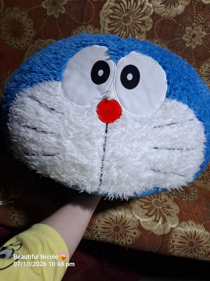 Sega BIG Doraemon Plush Cushion (Category: Plushies & Soft Toys) located in Quezon City. Submitted by NGClove (Listing ID 1466500455, Image 2). Description: - Selling one of my plushie collections -Official SEGA x Fujiko-Pro merchandise with tag attached - Adorable Doraemon face design with a soft fuzzy front and plush blue back - Perfect as a snug pillow or fun room decor for fans - Condition: Brand new with tag.