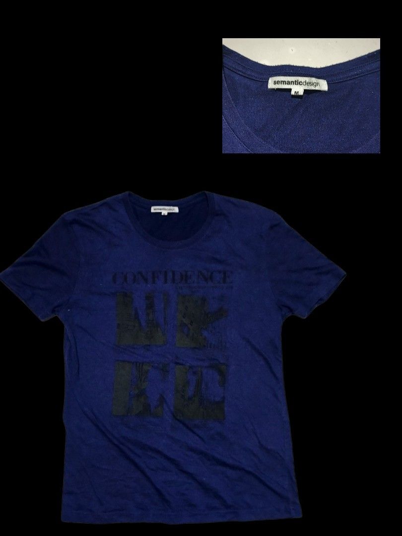 Semantic Design Blue Graphic Shirt (Category: Tshirts & Polo Shirts ) located in Calabanga. Submitted by bekneegear (Listing ID 1466482446, Image 1). Description: - Brand/Model: Semantic Design - Size: M - Color: Blue - Design: Bold 'CONFIDENCE' lettering with dark graphic blocks - Neckline: Crew neck - Material: Comfortable cotton - Fit: Casual everyday fit, easy to match with jeans or shorts.