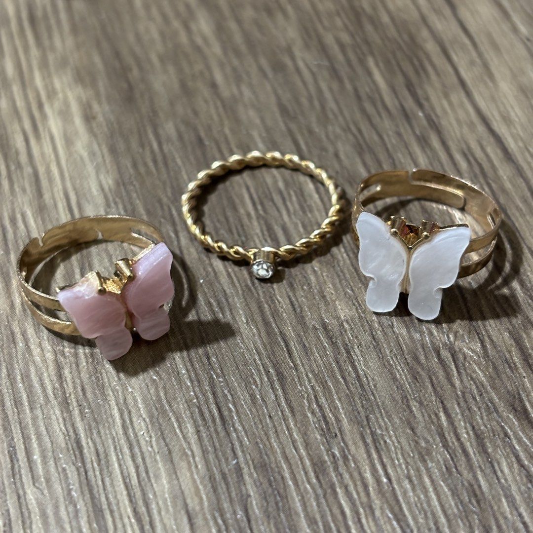 set of dainty rings (Category: Rings) located in Manila. Submitted by lavieelle (Listing ID 1466501887, Image 1). Description: - take all for 150 pesos - bought in italy, no flaws - adjustable shell butterfly rings and rope style ring with solitaire stone - rfs: decluttering.
