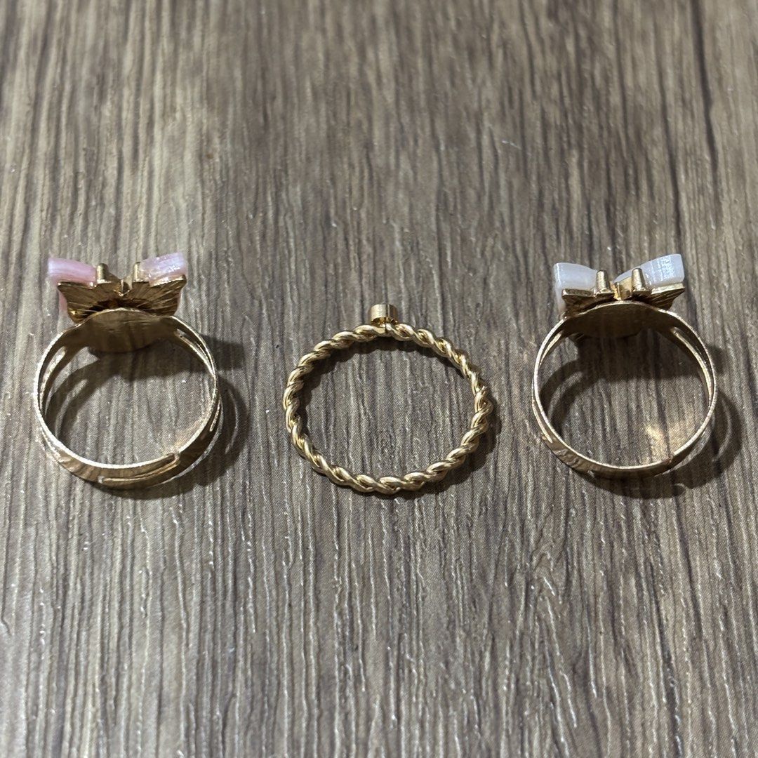 set of dainty rings (Category: Rings) located in Manila. Submitted by lavieelle (Listing ID 1466501887, Image 2). Description: - take all for 150 pesos - bought in italy, no flaws - adjustable shell butterfly rings and rope style ring with solitaire stone - rfs: decluttering.