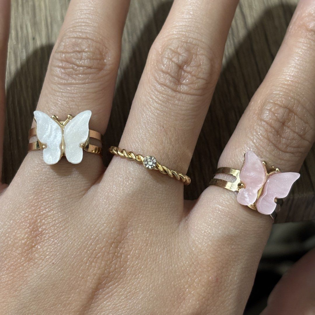 set of dainty rings (Category: Rings) located in Manila. Submitted by lavieelle (Listing ID 1466501887, Image 3). Description: - take all for 150 pesos - bought in italy, no flaws - adjustable shell butterfly rings and rope style ring with solitaire stone - rfs: decluttering.
