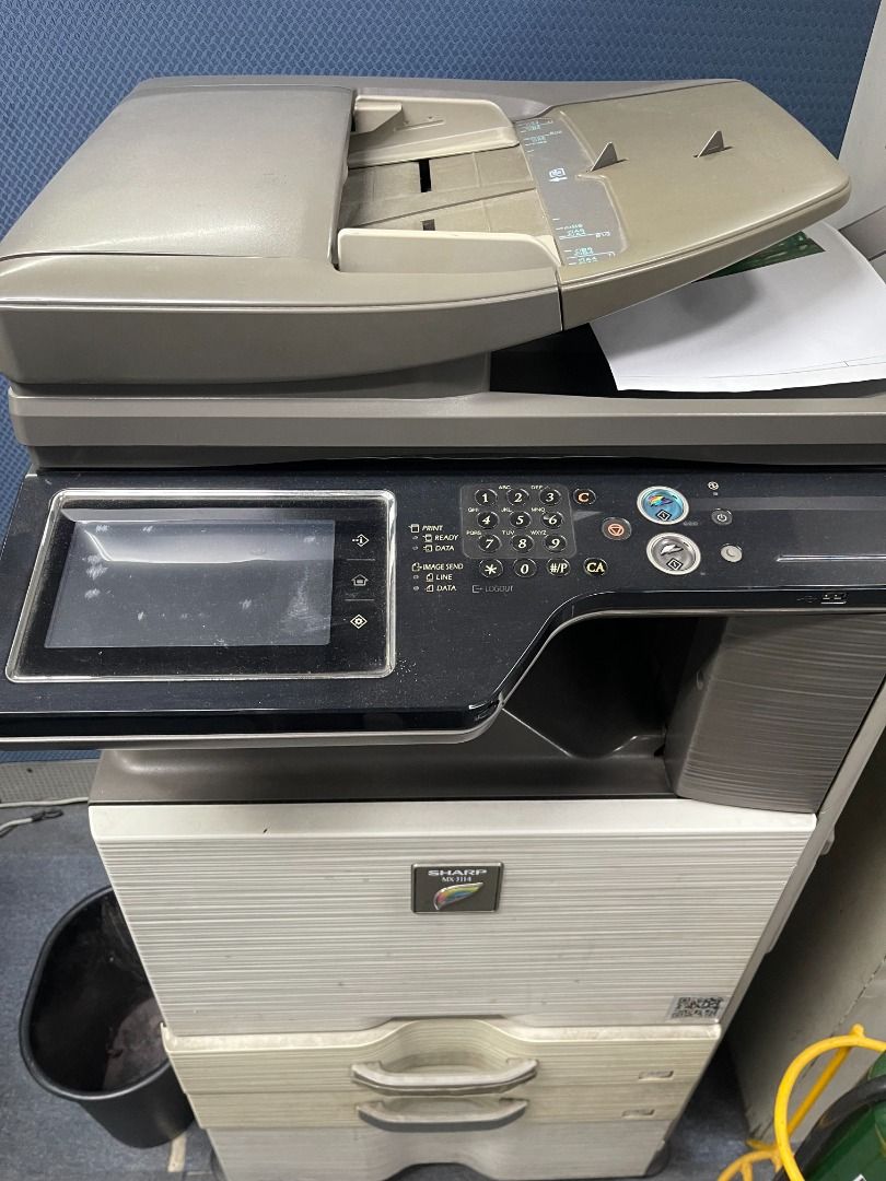 Sharp Multi-Function Printer Office Copier (Category: Printers, Scanners & Copiers) located in Caloocan City. Submitted by topgun_999 (Listing ID 1466350711, Image 2). Description: - Heavy-duty floor-standing office machine for printing, scanning, and copying - Equipped with a user-friendly large touchscreen and physical numeric keypad - Includes an automatic document feeder on top for efficient multi-page scanning - Features dual paper storage d