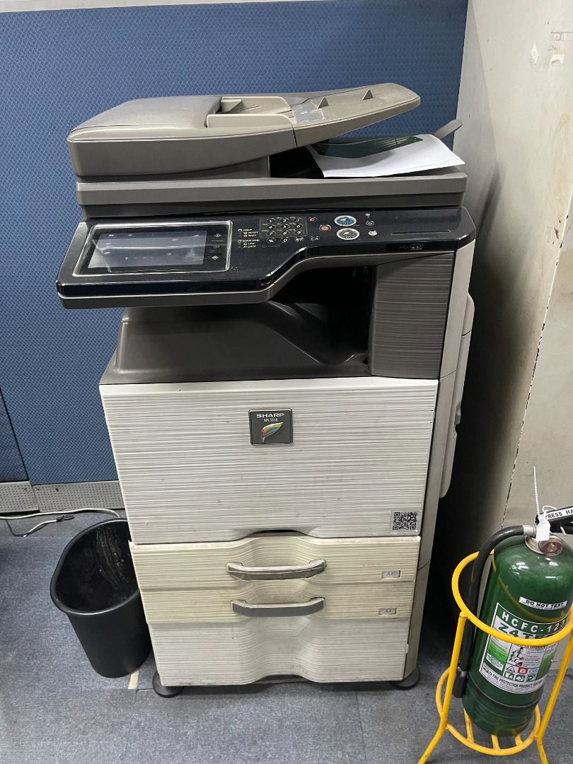 Sharp Multi-Function Printer Office Copier (Category: Printers, Scanners & Copiers) located in Caloocan City. Submitted by topgun_999 (Listing ID 1466350711, Image 1). Description: - Heavy-duty floor-standing office machine for printing, scanning, and copying - Equipped with a user-friendly large touchscreen and physical numeric keypad - Includes an automatic document feeder on top for efficient multi-page scanning - Features dual paper storage d