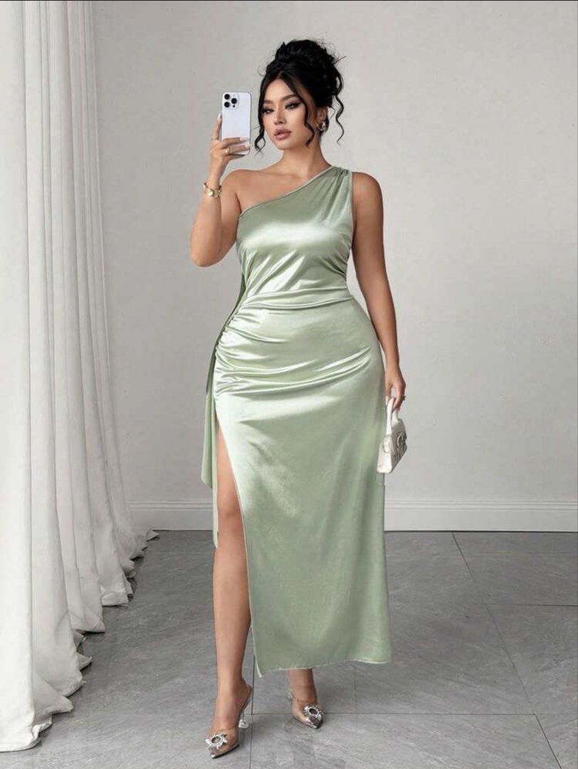 SHEIN Asymmetrical Plus Size Dress (Category: Dresses) located in Makati City. Submitted by dpfran (Listing ID 1466383158, Image 1). Description: - Color: Sage green - Fabric: Smooth, shiny satin - Length: Midi - Neckline: One-shoulder with thin strap detailing across the back - Fit: Fitted bodice with flattering ruching gathered down the right hip - Details: High side slit on the right leg and an asymmetrical draped ruffle cascading down the bac