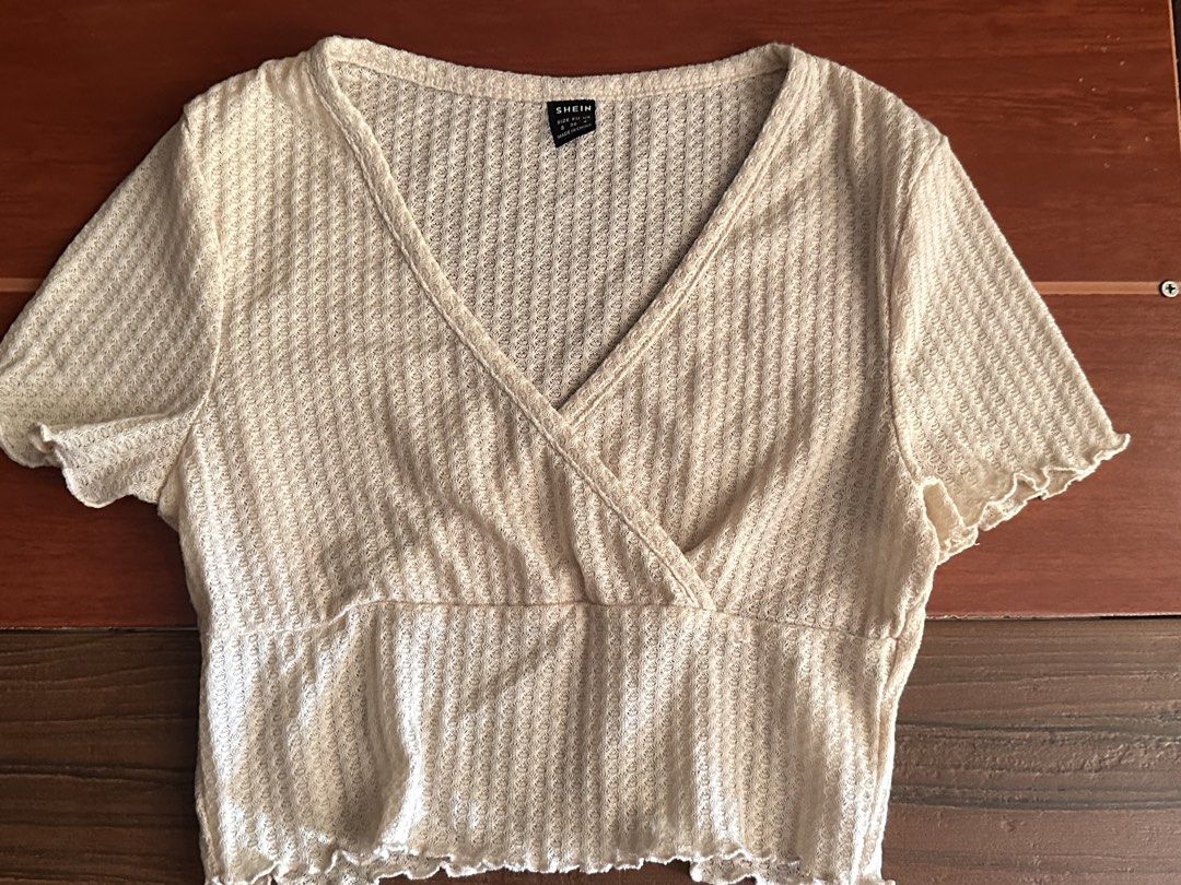 SHEIN Beige V-Neck Crop Top Size S (Category: Sleeveless) located in Minalabac. Submitted by summerrish (Listing ID 1466365422, Image 1). Description: - Brand: Shein - Style: V-neck wrap crop top with short sleeves and lettuce hem - Color: Light Beige - Size: Small (EU 36, US 4) - Material: Textured waffle knit, super lightweight and stretchy - Condition: Great casual piece for warmer weather.