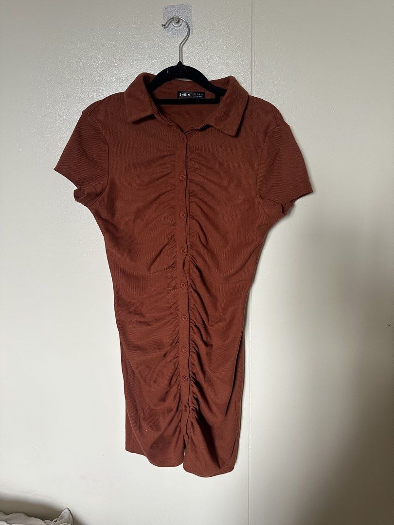 SHEIN Brown Ribbed Collared Ruched Mini Dress (Category: Dresses) located in Mandaluyong City. Submitted by youarecutejeans (Listing ID 1466439772, Image 1). Description: - Brand: SHEIN - Style: Brown collared mini dress with form-fitting silhouette - Material: Stretchy ribbed fabric - Details: Short sleeves, front button placket, and center front ruching.