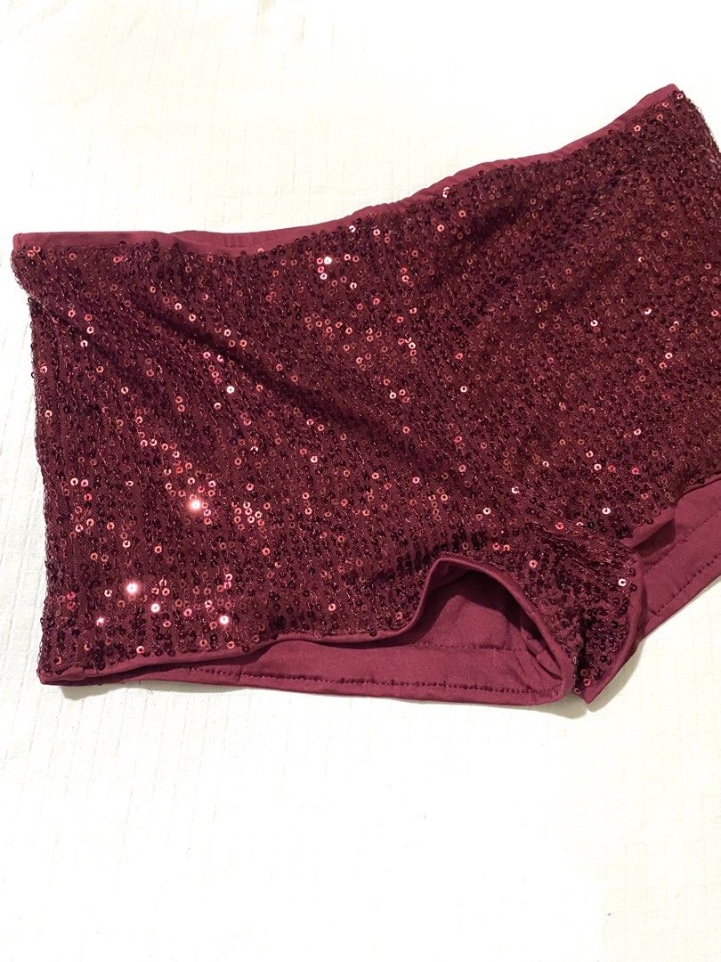 SHEIN Burgundy Sequin Hot Pants Size S (Category: Shorts) located in Quezon City. Submitted by getitrightaway.ph (Listing ID 1466442047, Image 3). Description: Burgundy sparkly sequin hot pants from Shein. Size small. Elastic waistband, easy pull-on style. Fully covered in dark red sequins that catch the light. Stretchy fabric inside for comfortable wear. Great statement piece for parties, festivals, or nights out. Worn once, still in excellent s